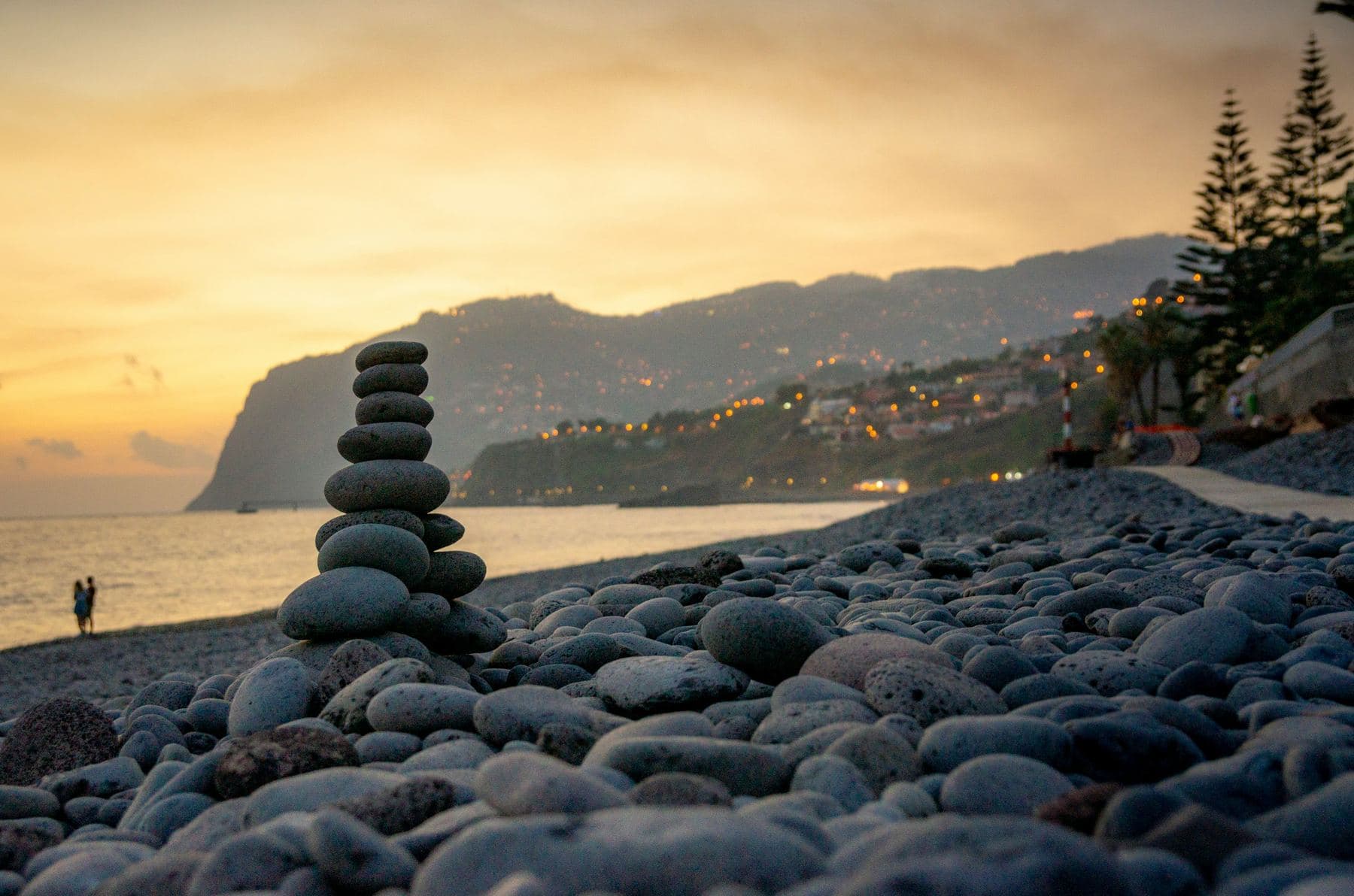 A pebble beach in Madeira at sunset