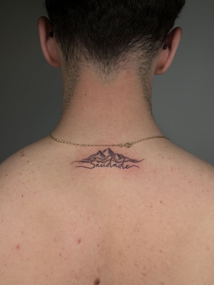 Mountain line tattooed on the back of the neck